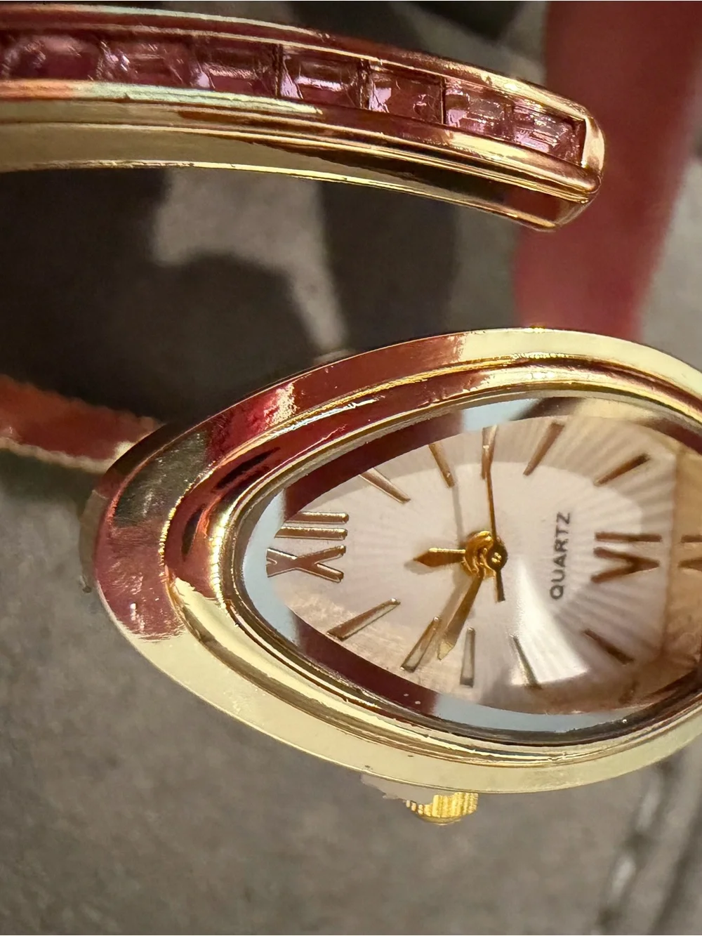 Gold-Plated Snake Cuff Bracelet Watch with Pink and Green Sones